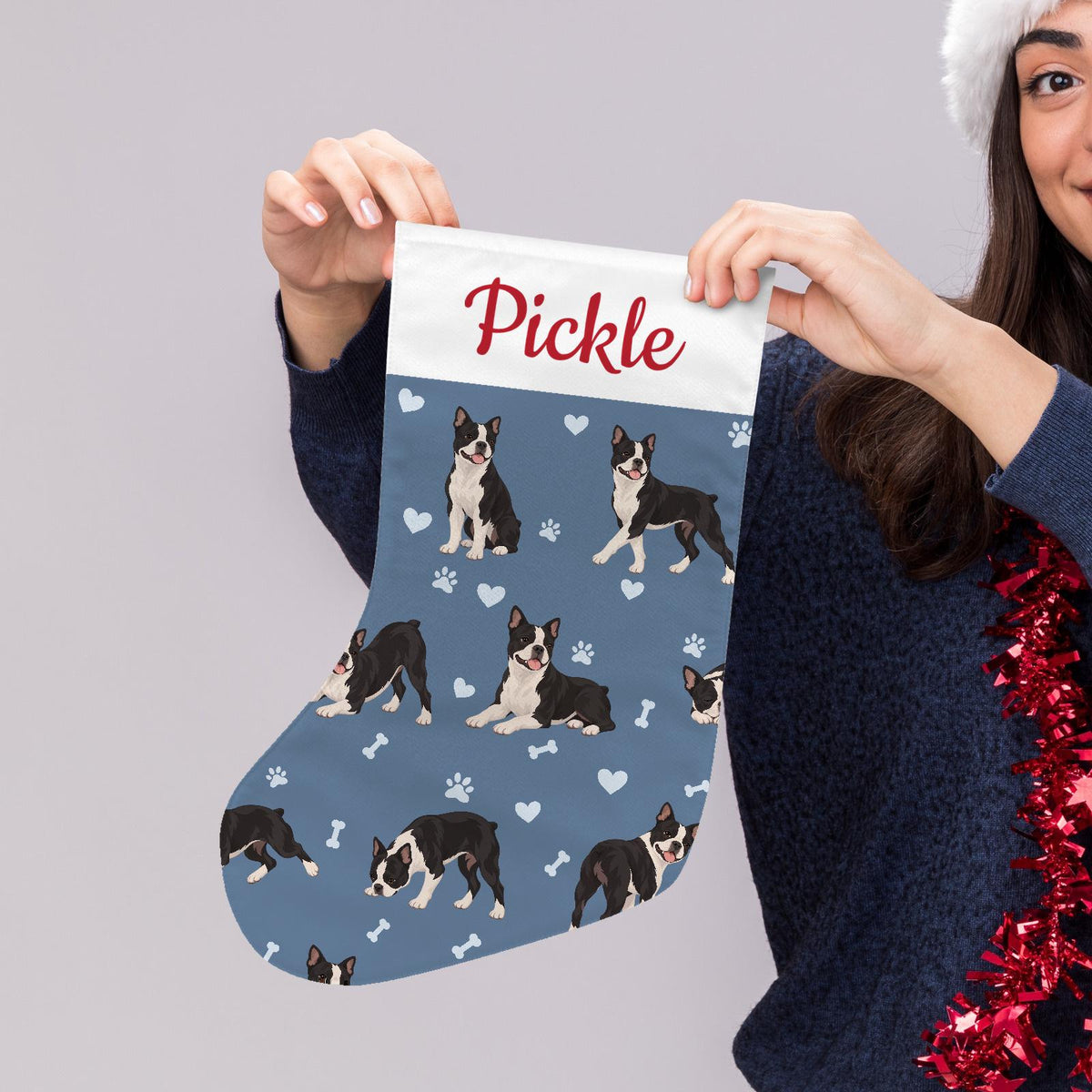 Boston Terrier Christmas stocking on slate blue background with example name Pickle in red script on the white cuff; view 5.