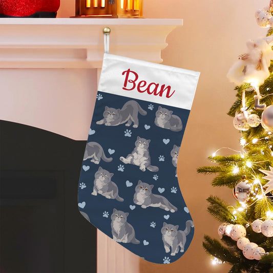 Exotic Shorthair Christmas stocking on deep navy background with example name Bean in red script on the white cuff; view 1.