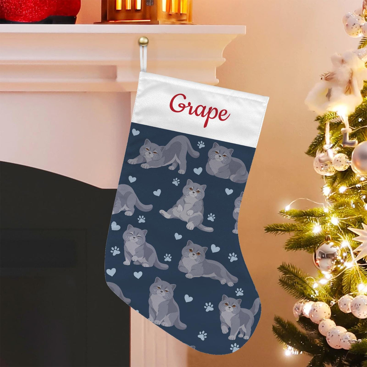 British Shorthair Christmas stocking on deep navy background with example name Grape in red script on the white cuff; view 1.