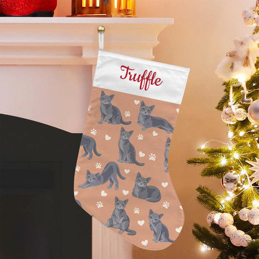 Russian Blue Christmas stocking on peach background with example name Truffle in red script on the white cuff; view 1.