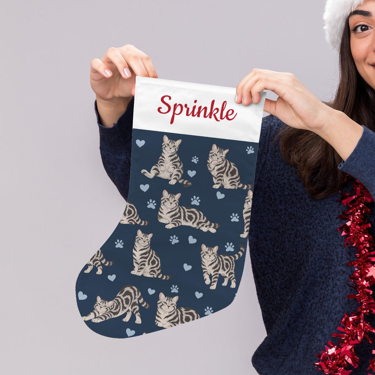 American Shorthair Christmas stocking on deep navy background with example name Sprinkle in red script on the white cuff; view 5.