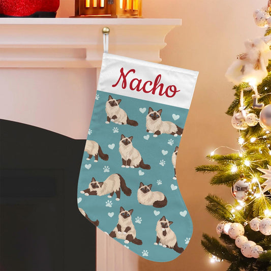 Birman Christmas stocking on muted teal background with example name Nacho in red script on the white cuff; view 1.