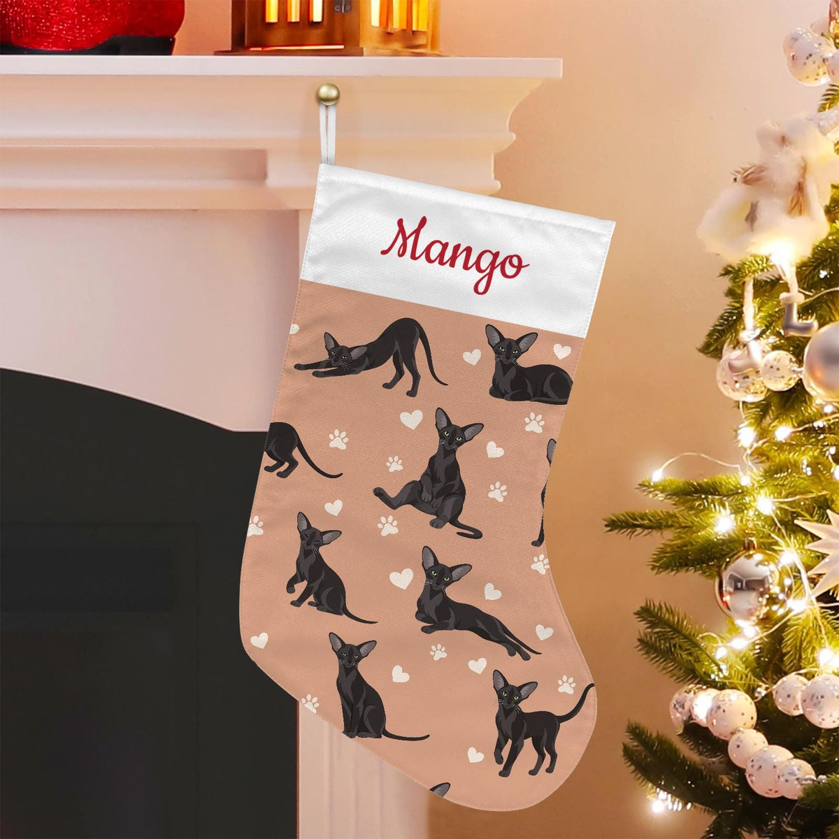 Oriental Christmas stocking on peach background with example name Mango in red script on the white cuff; view 1.