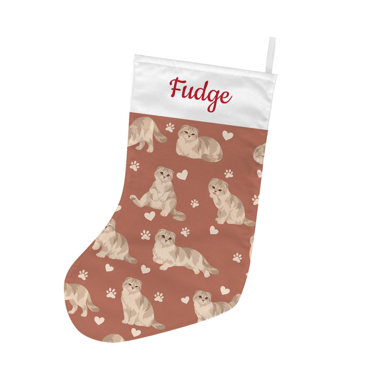 Scottish Fold Christmas stocking on muted terracotta background with example name Fudge in red script on the white cuff; view 2.