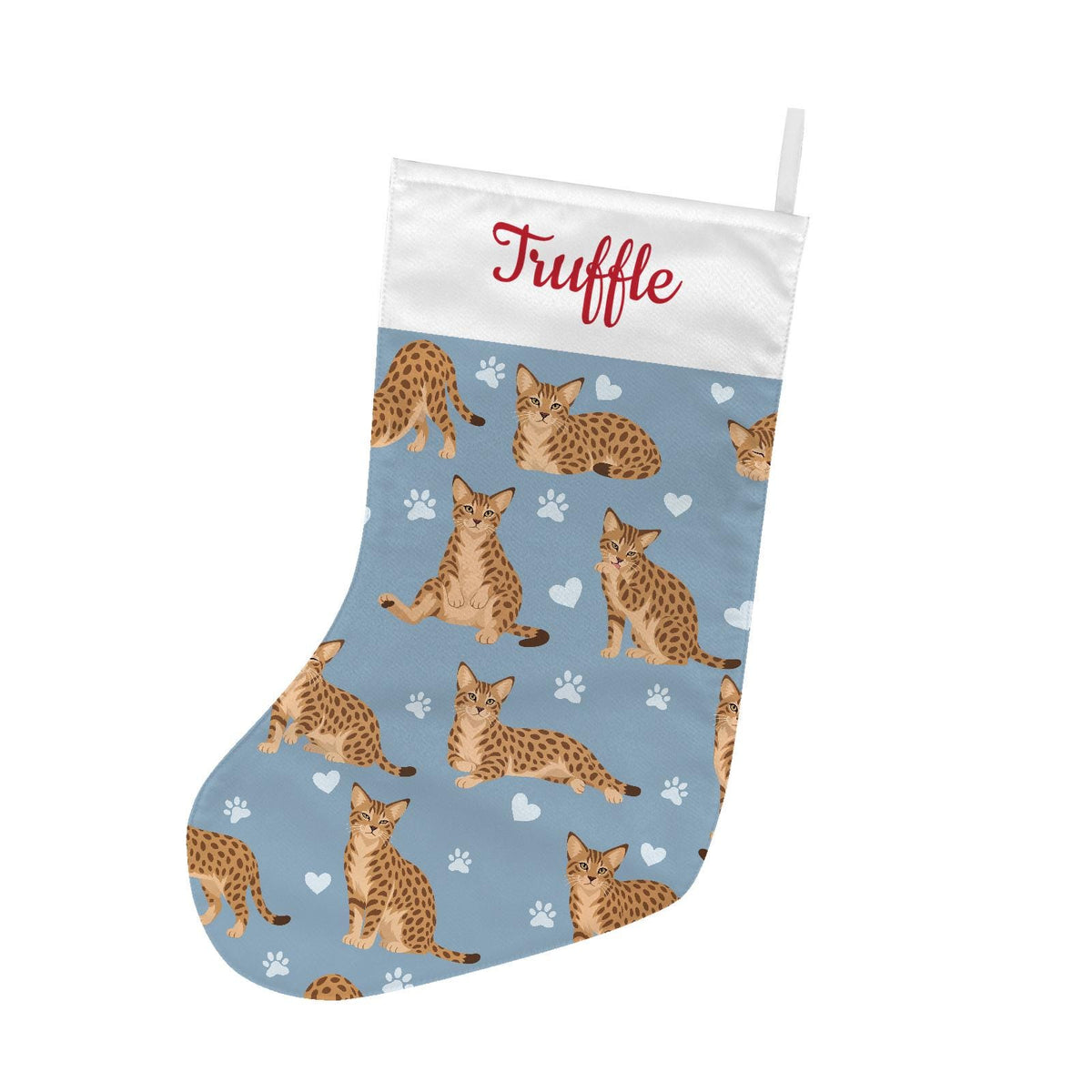 Ocicat Christmas stocking on dusty blue background with example name Truffle in red script on the white cuff; view 2.