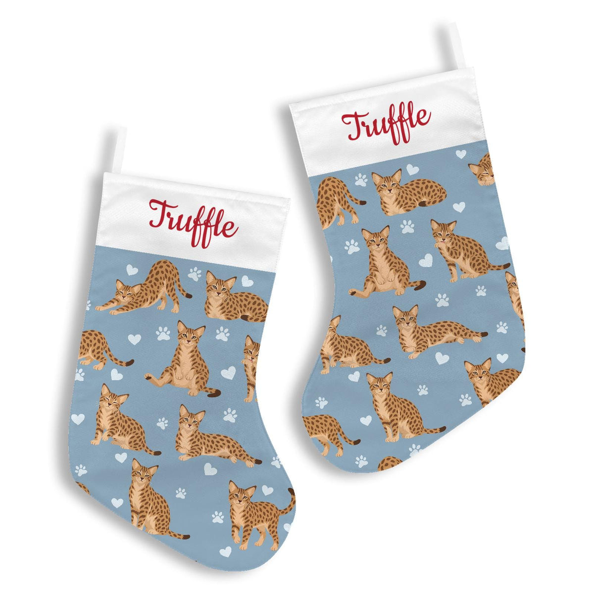 Ocicat Christmas stocking on dusty blue background with example name Truffle in red script on the white cuff; view 3.