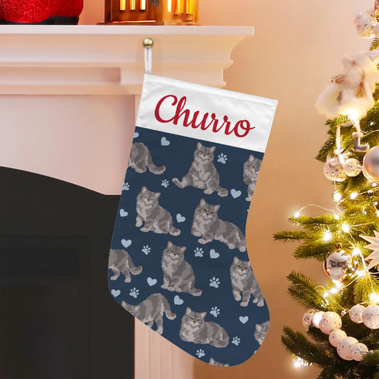 Selkirk Rex Christmas stocking on deep navy background with example name Churro in red script on the white cuff; view 1.