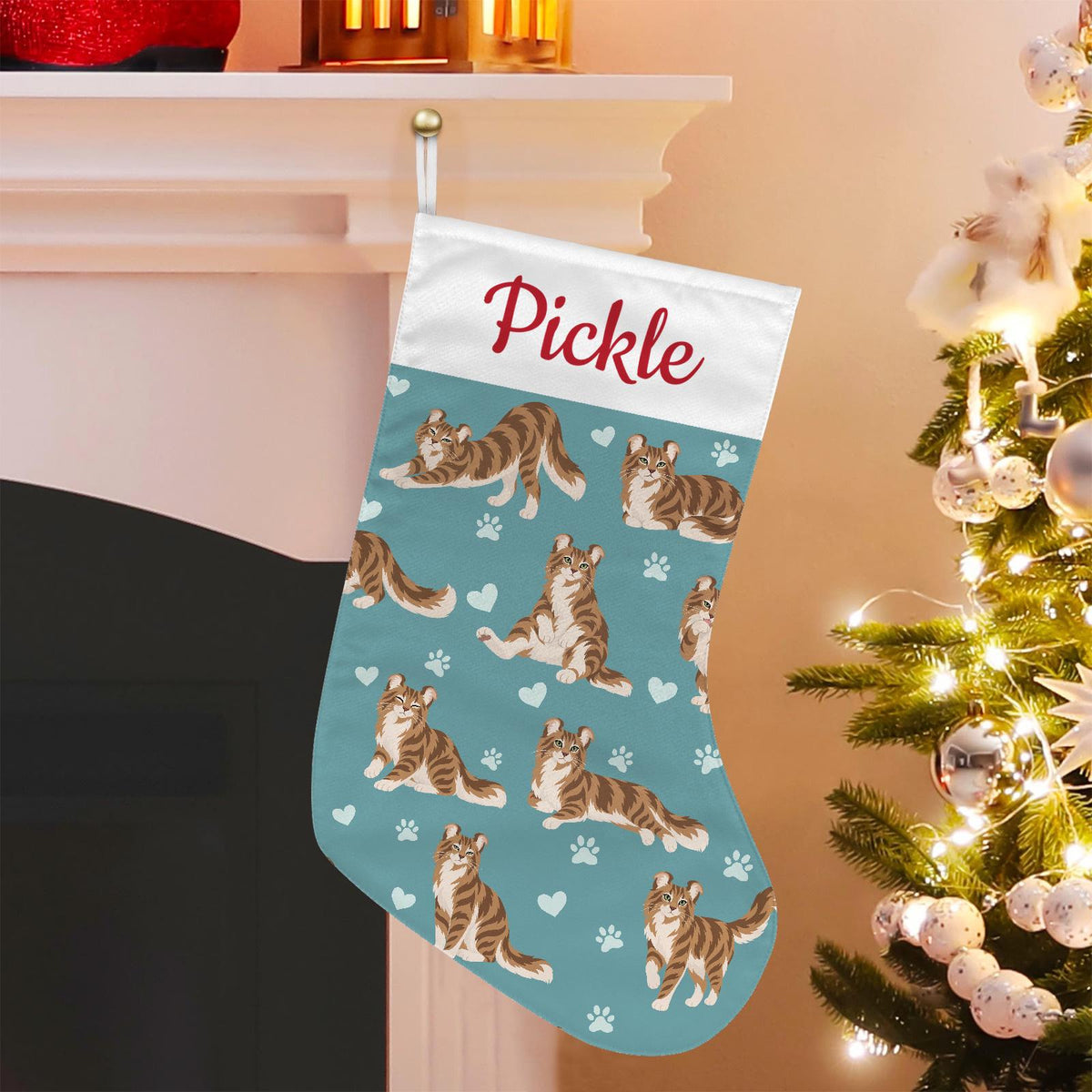 American Curl Christmas stocking on muted teal background with example name Pickle in red script on the white cuff; view 1.