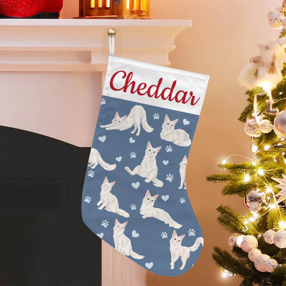 Turkish Angora Christmas stocking on slate blue background with example name Cheddar in red script on the white cuff; view 1.
