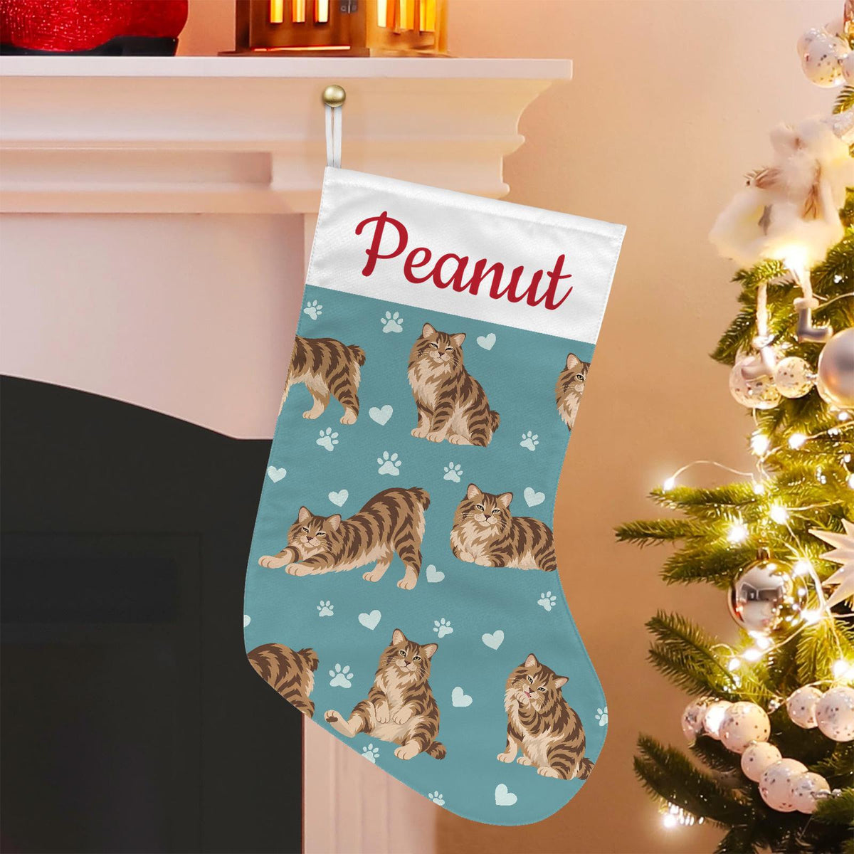 American Bobtail Christmas stocking on muted teal background with example name Peanut in red script on the white cuff; view 1.