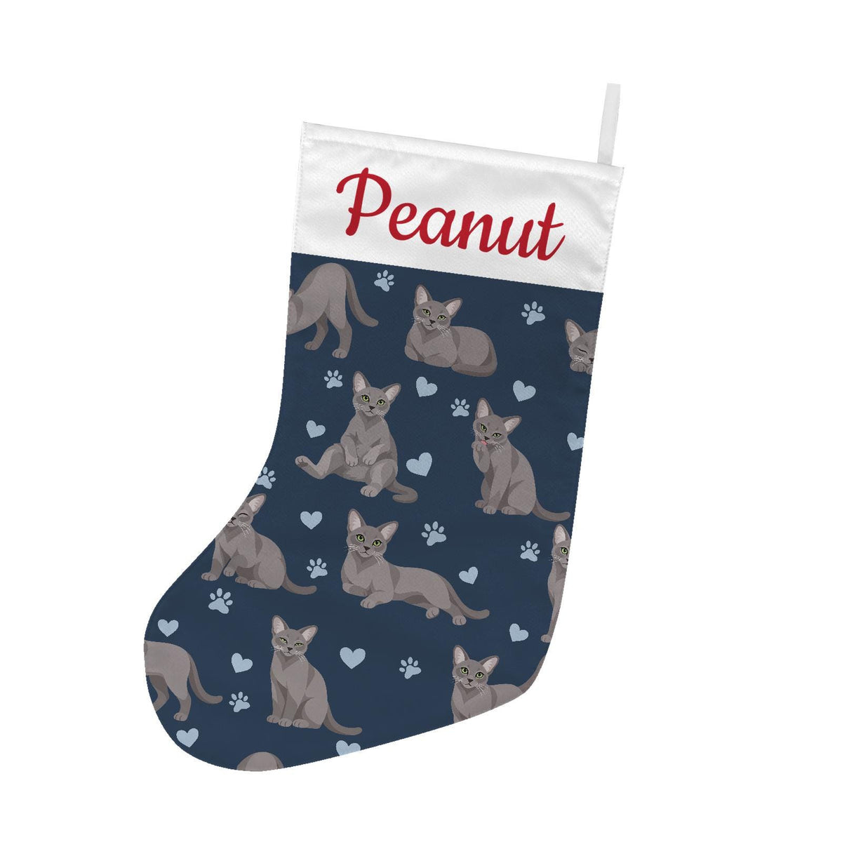 Korat Christmas stocking on deep navy background with example name Peanut in red script on the white cuff; view 2.