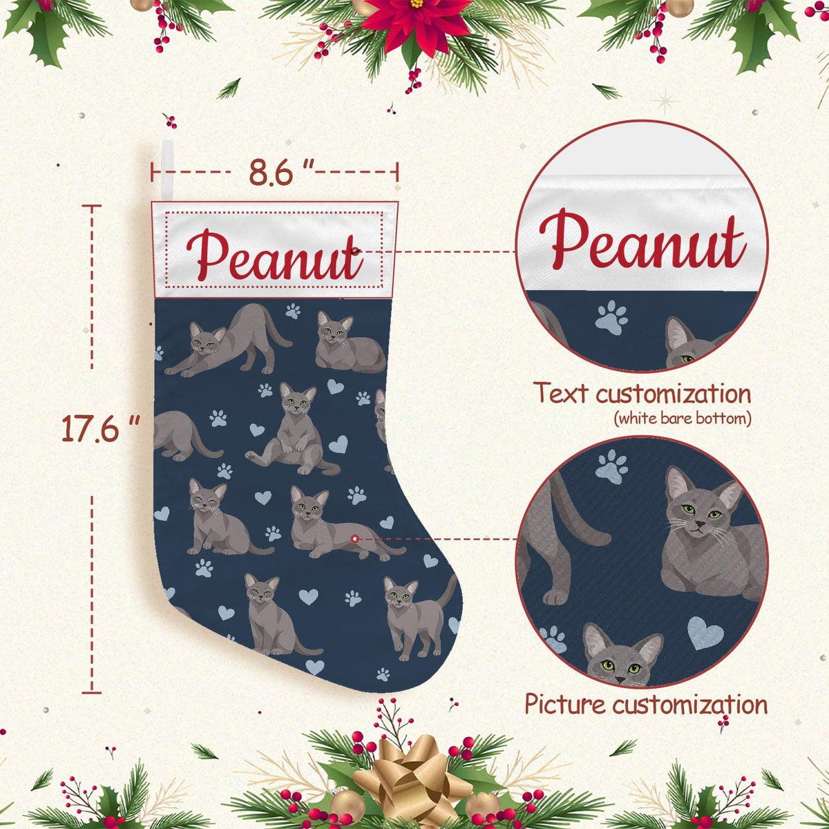 Korat Christmas stocking on deep navy background with example name Peanut in red script on the white cuff; view 4.