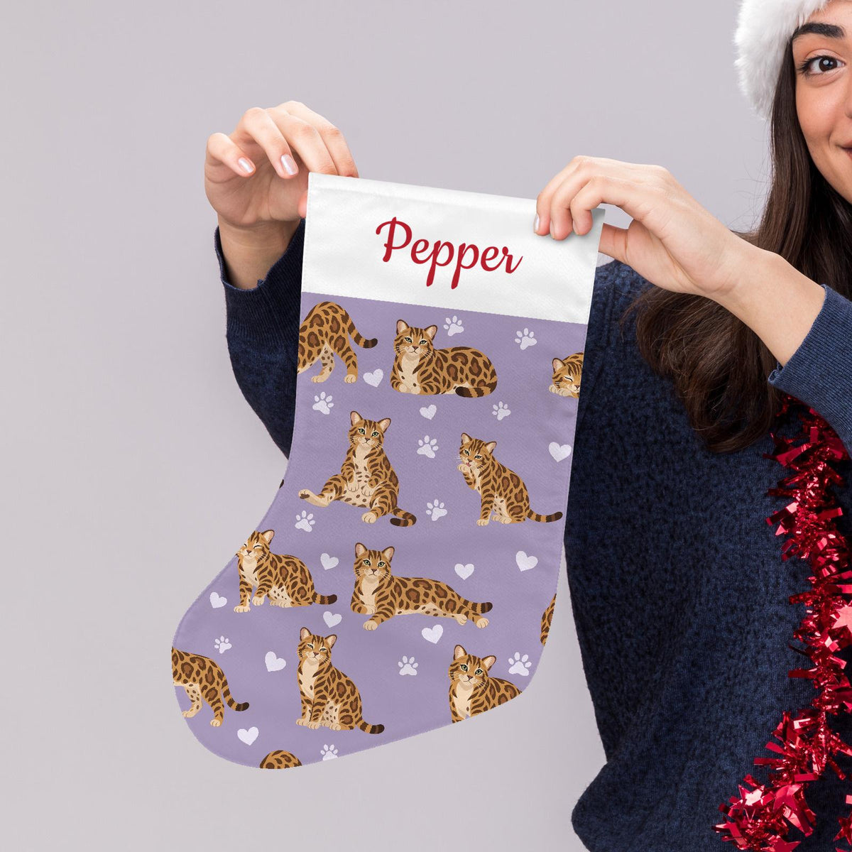 Bengal Christmas stocking on soft lavender background with example name Pepper in red script on the white cuff; view 5.