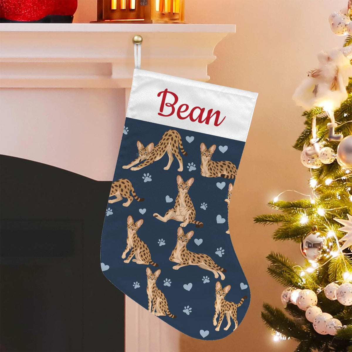 Savannah Christmas stocking on deep navy background with example name Bean in red script on the white cuff; view 1.