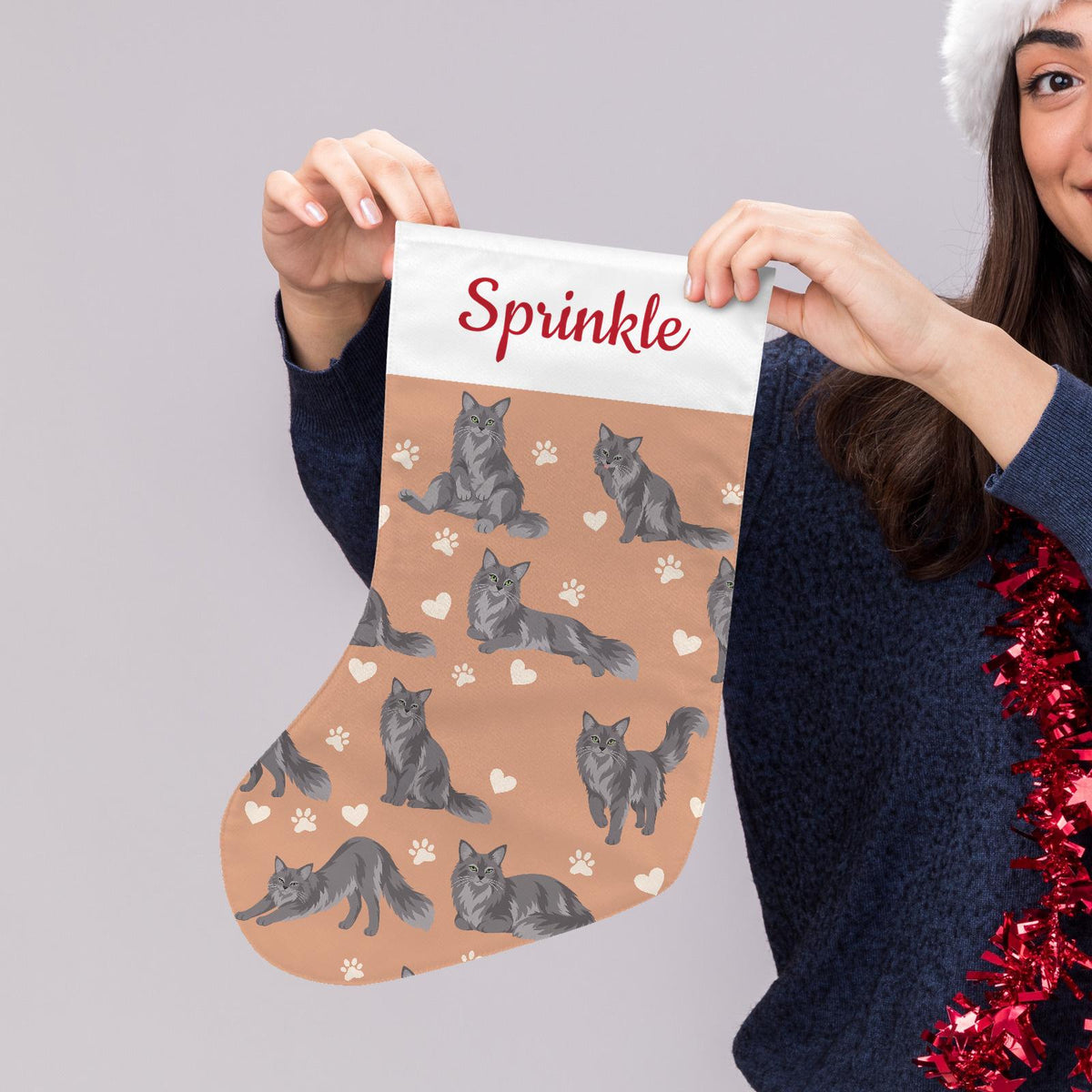 Nebelung Christmas stocking on peach background with example name Sprinkle in red script on the white cuff; view 5.