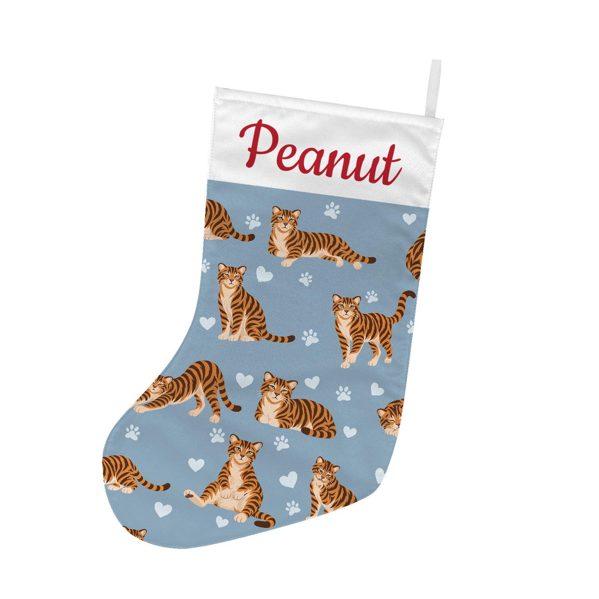 Toyger Christmas stocking on dusty blue background with example name Peanut in red script on the white cuff; view 2.