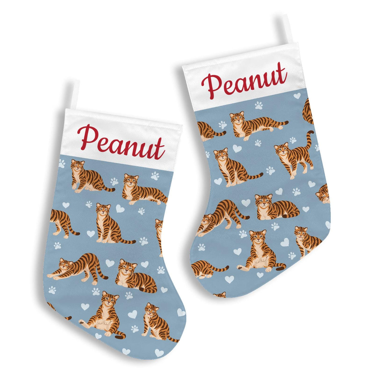 Toyger Christmas stocking on dusty blue background with example name Peanut in red script on the white cuff; view 3.