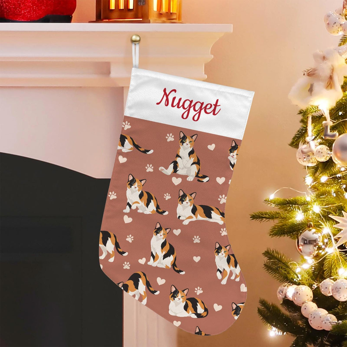 Domestic Shorthair Christmas stocking on muted terracotta background with example name Nugget in red script on the white cuff; view 1.