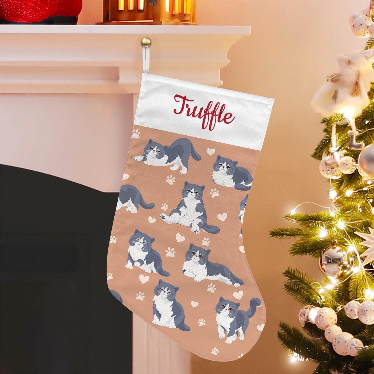 Exotic Shorthair Blue and white bicolor Christmas stocking on peach background with example name Truffle in red script on the white cuff; view 1.