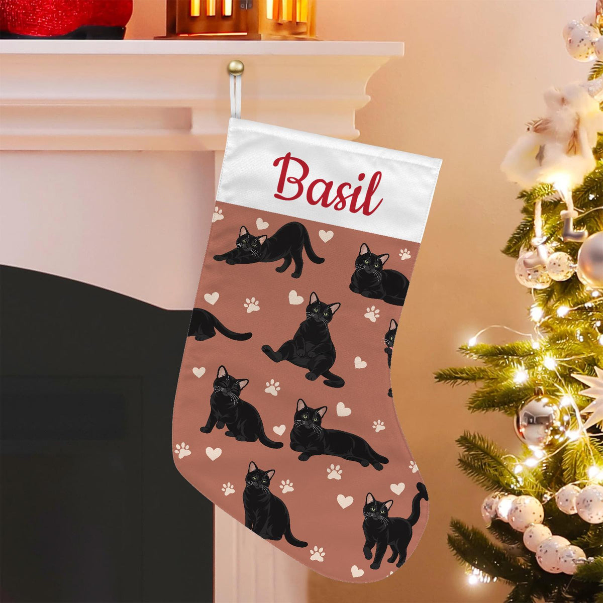 Domestic Shorthair Black Christmas stocking on muted terracotta background with example name Basil in red script on the white cuff; view 1.