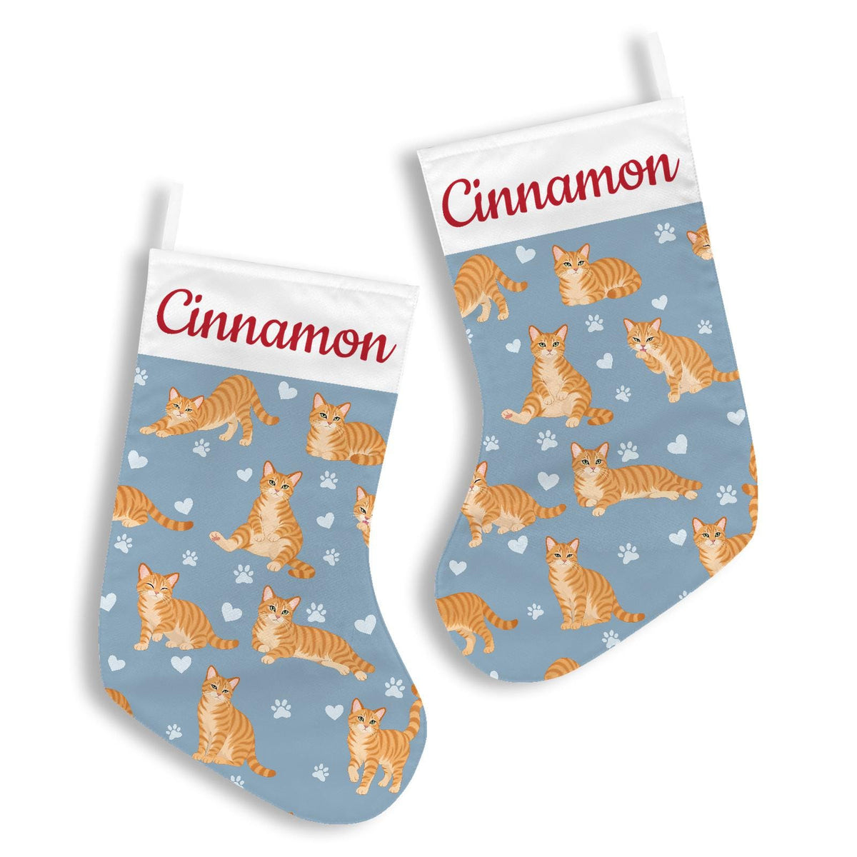 Domestic Shorthair Orange Christmas stocking on dusty blue background with example name Cinnamon in red script on the white cuff; view 3.