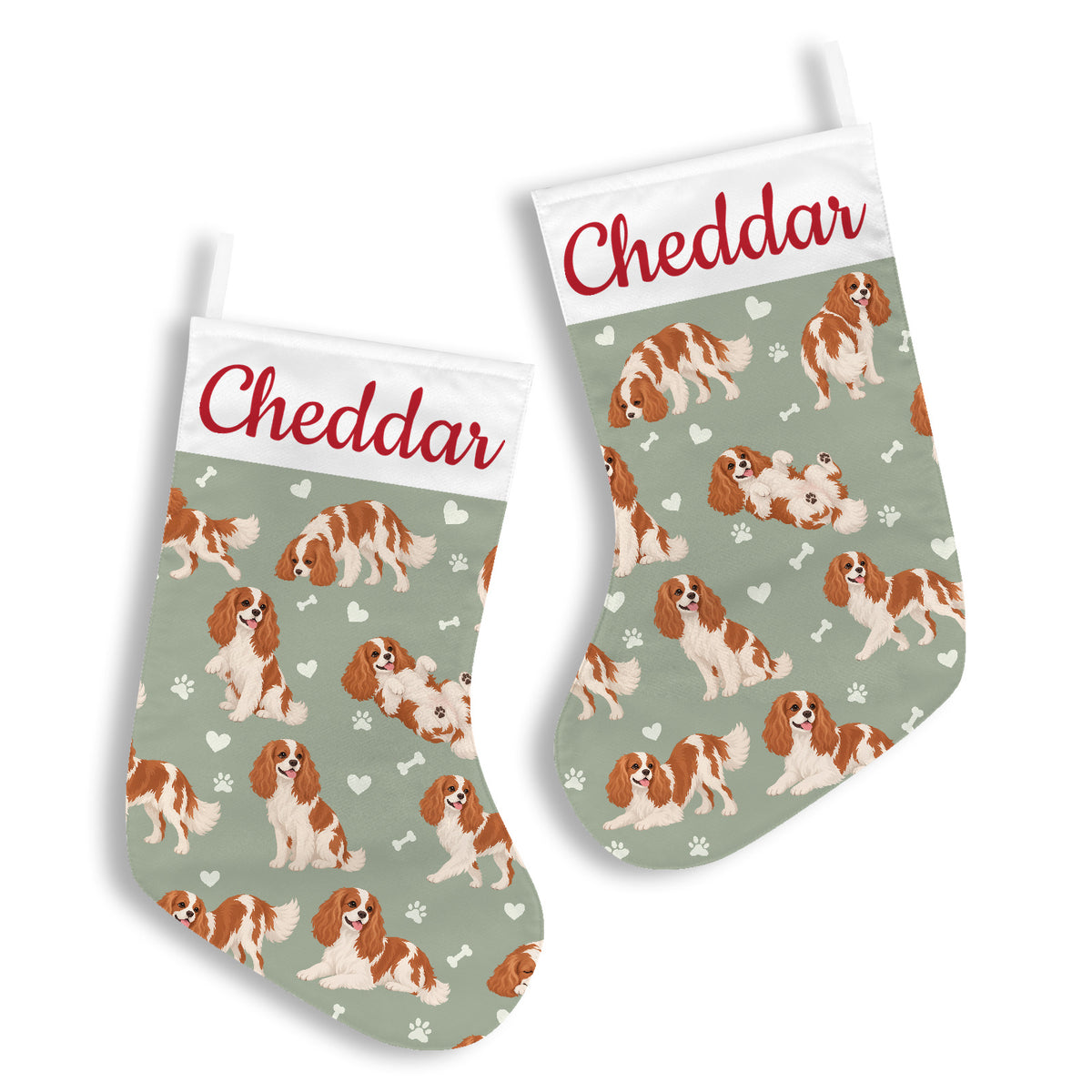 Cavalier King Charles Spaniel Christmas stocking on soft sage background with example name Cheddar in red script on the white cuff; view 2.