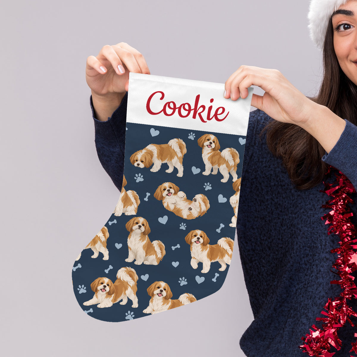 Shih Tzu Christmas stocking on deep navy background with example name Cookie in red script on the white cuff; view 4.