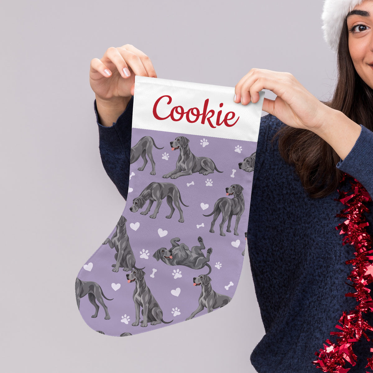 Great Dane Christmas stocking on soft lavender background with example name Cookie in red script on the white cuff; view 4.
