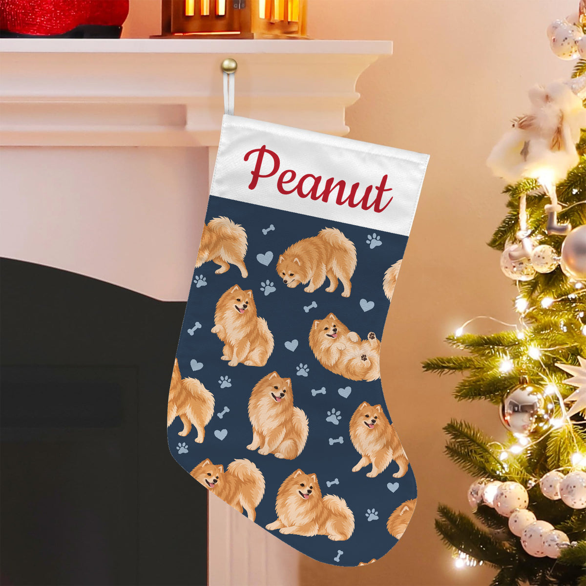 Pomeranian Christmas stocking on deep navy background with example name Peanut in red script on the white cuff; view 5.