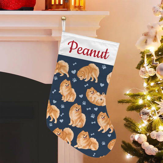 Pomeranian Christmas stocking on deep navy background with example name Peanut in red script on the white cuff; view 5.