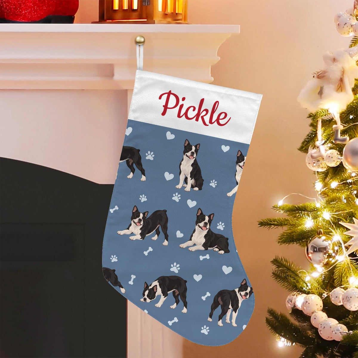 Boston Terrier Christmas stocking on slate blue background with example name Pickle in red script on the white cuff; view 1.