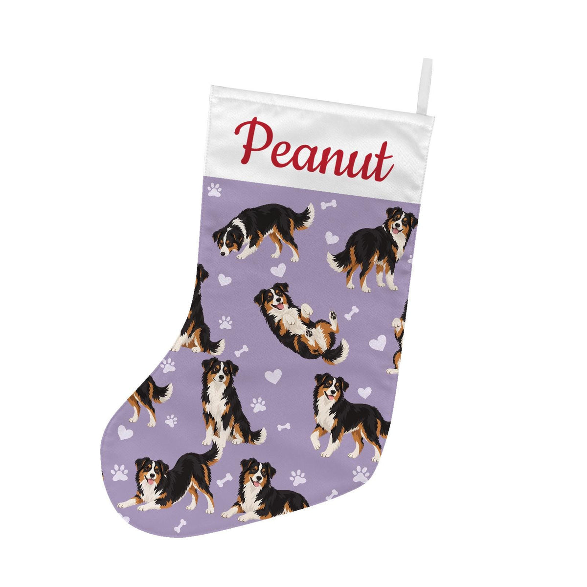 Miniature American Shepherd Christmas stocking on soft lavender background with example name Peanut in red script on the white cuff; view 2.