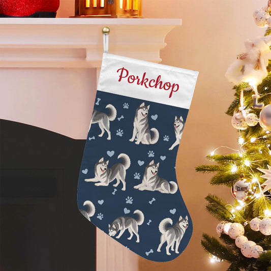 Siberian Husky Christmas stocking on deep navy background with example name Porkchop in red script on the white cuff; view 1.