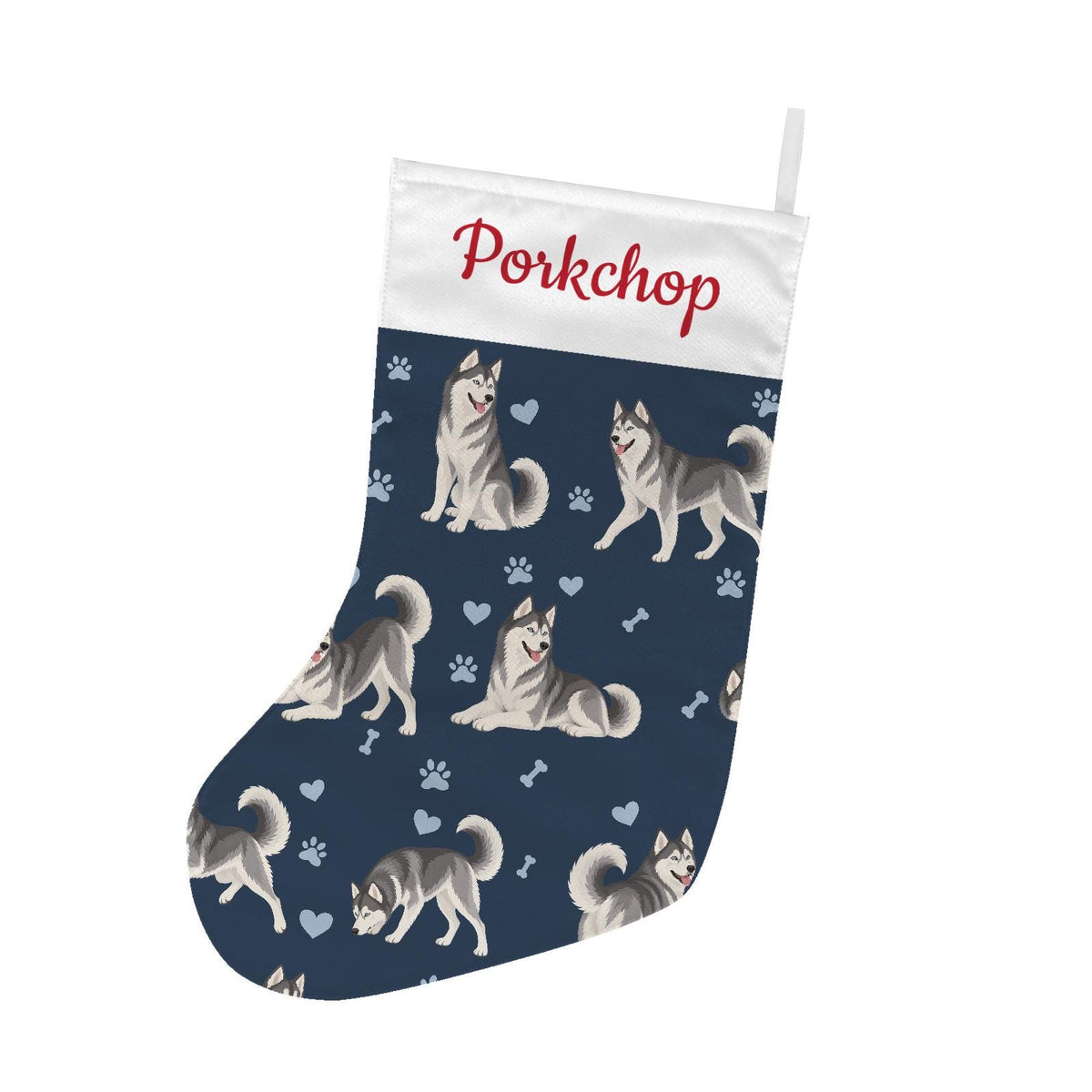 Siberian Husky Christmas stocking on deep navy background with example name Porkchop in red script on the white cuff; view 2.