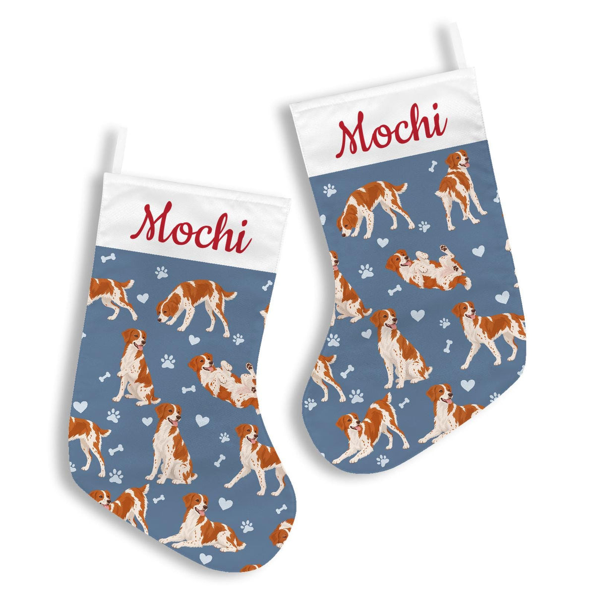 Brittany Christmas stocking on slate blue background with example name Mochi in red script on the white cuff; view 3.