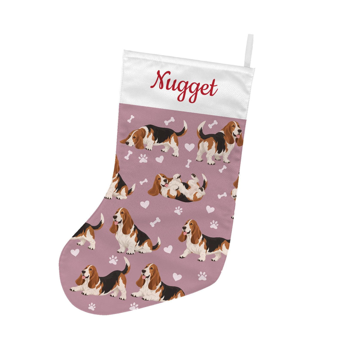 Basset Hound Christmas stocking on dusty rose background with example name Nugget in red script on the white cuff; view 2.