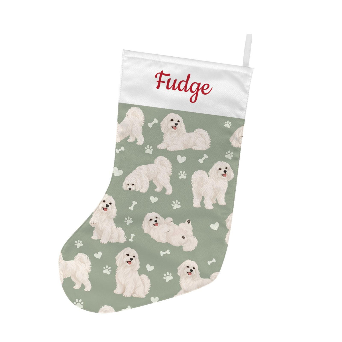 Maltese Christmas stocking on soft sage background with example name Fudge in red script on the white cuff; view 2.