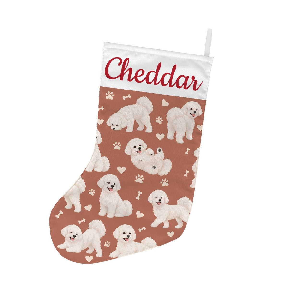 Bichon Frise Christmas stocking on muted terracotta background with example name Cheddar in red script on the white cuff; view 2.
