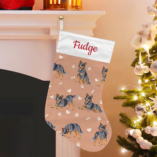 Australian Cattle Dog Christmas stocking on peach background with example name Fudge in red script on the white cuff; view 1.