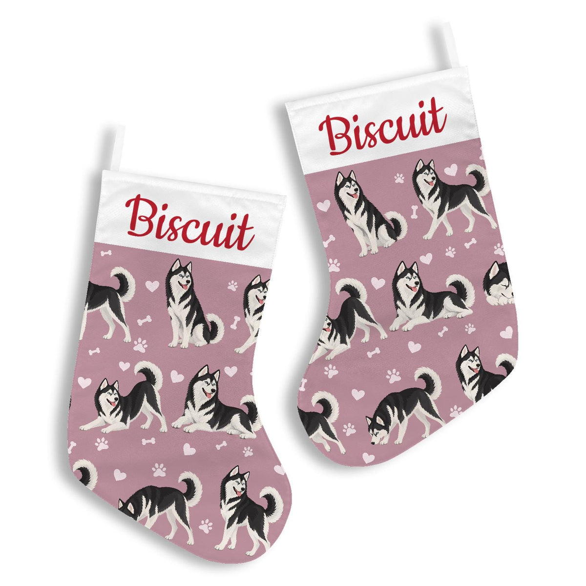 Siberian Husky Black and White Christmas stocking on dusty rose background with example name Biscuit in red script on the white cuff; view 3.