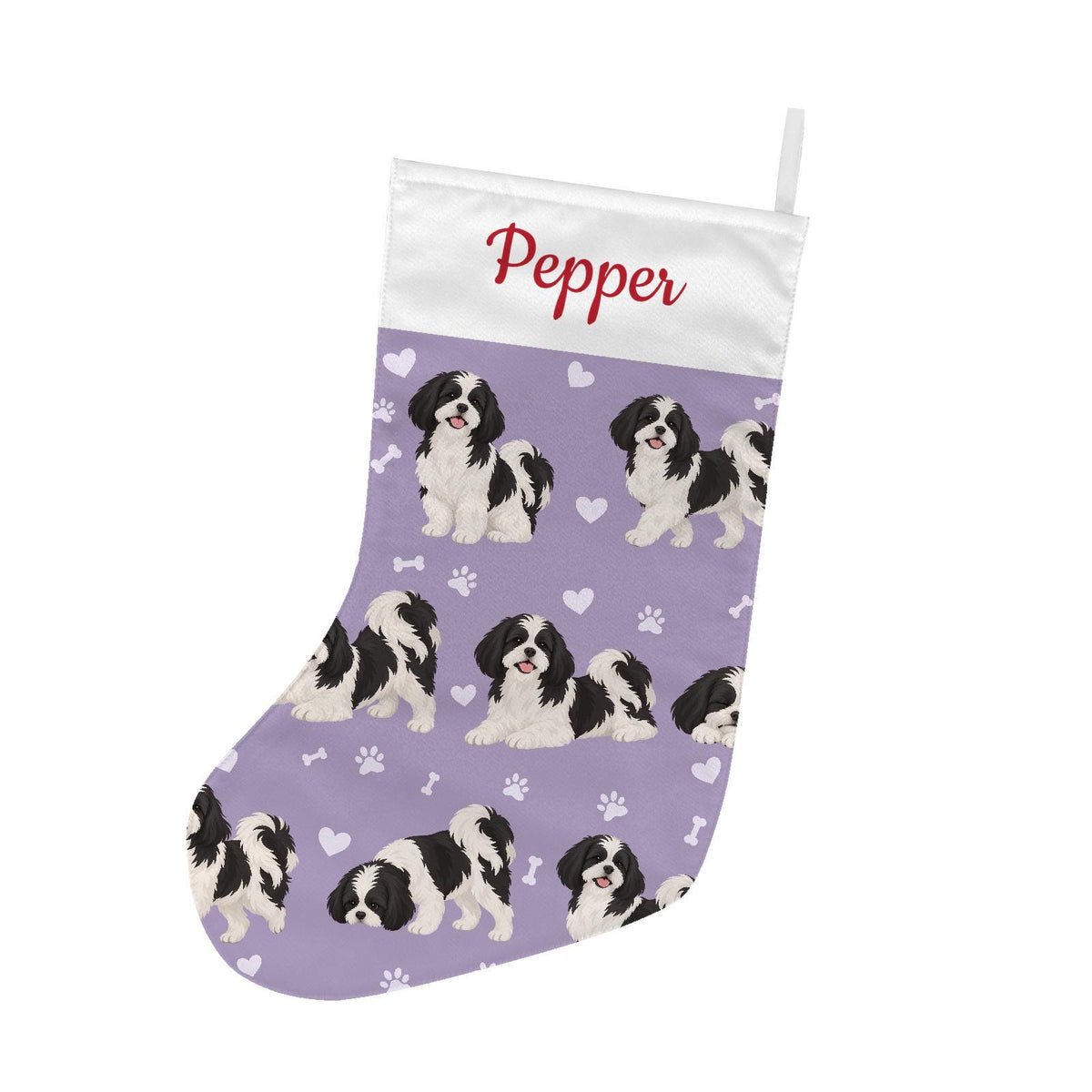 Shih Tzu Black and White Christmas stocking on soft lavender background with example name Pepper in red script on the white cuff; view 2.