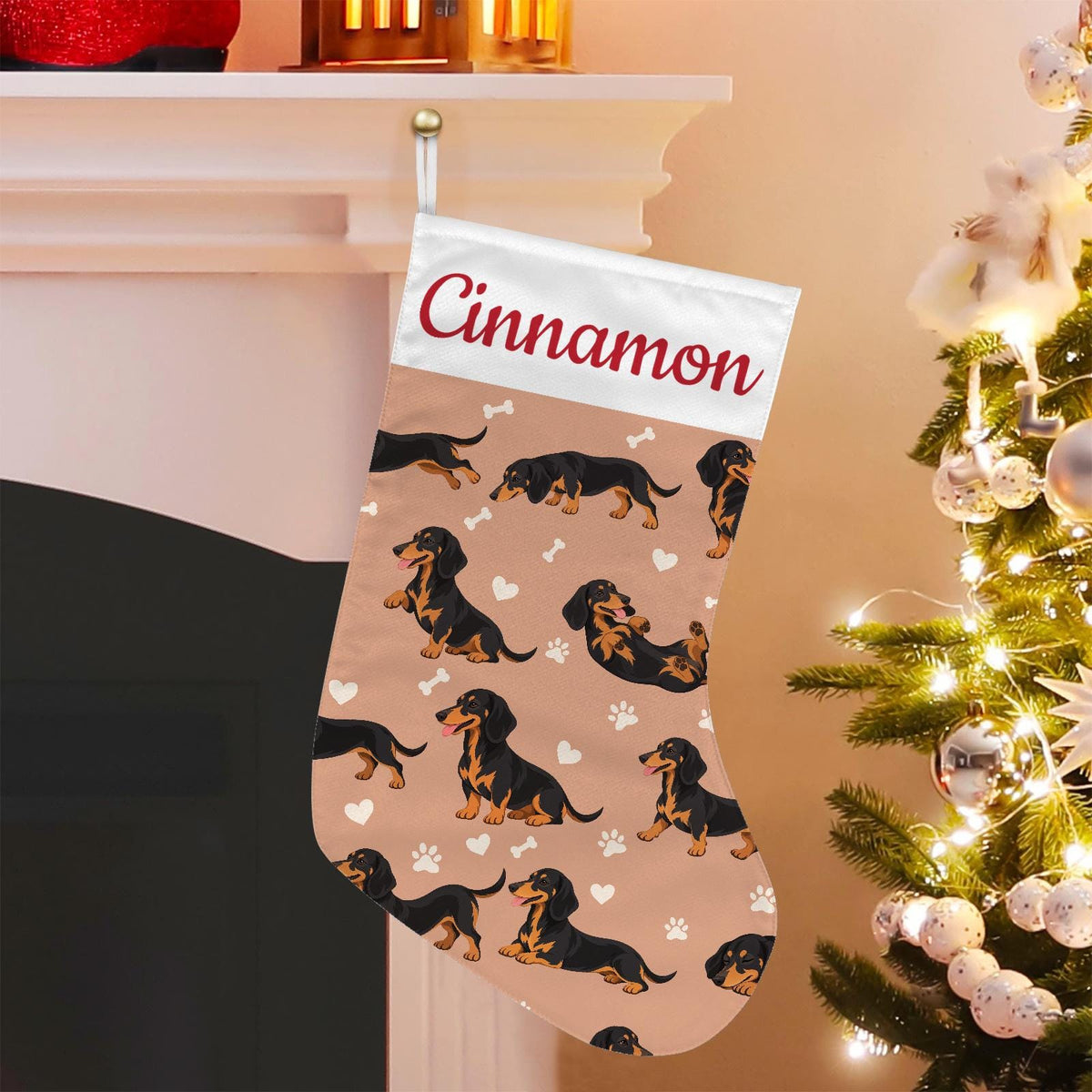 Dachshund Black and Tan Christmas stocking on peach background with example name Cinnamon in red script on the white cuff; view 1.