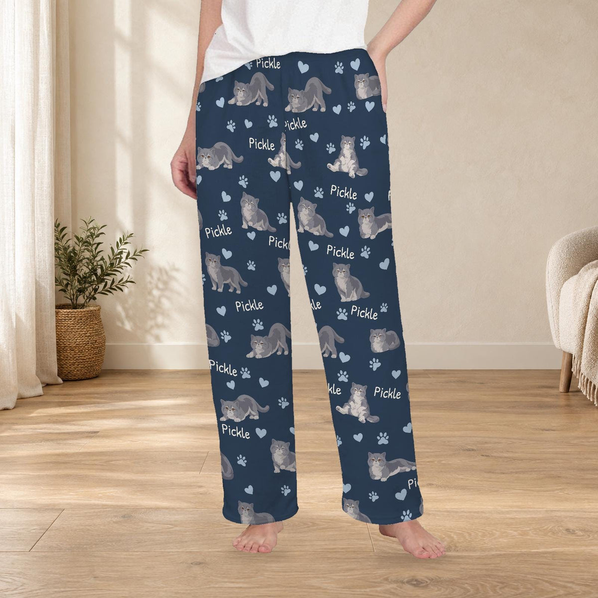 Exotic Shorthair personalized fleece pajama trousers on a model; women's fit, front view. Cozy neutral room background.