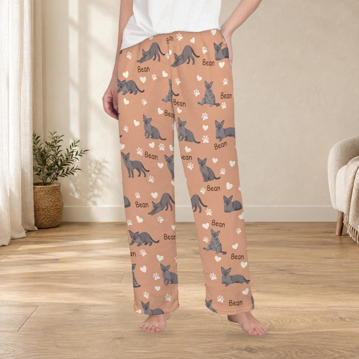European Burmese personalized fleece pajama trousers on a model; women's fit, front view. Cozy neutral room background.