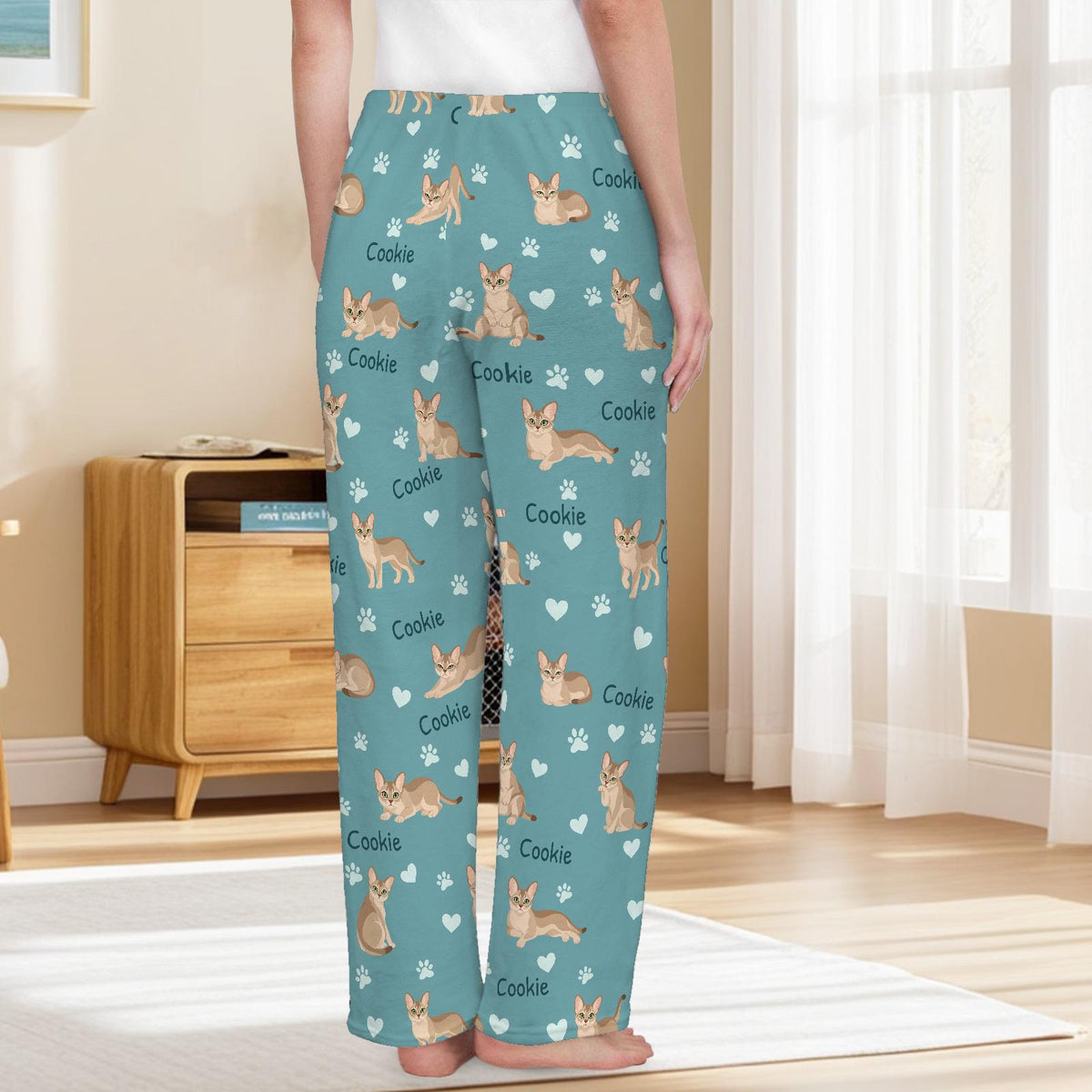 Singapura personalized pet name fleece pajama trousers, back lifestyle view.