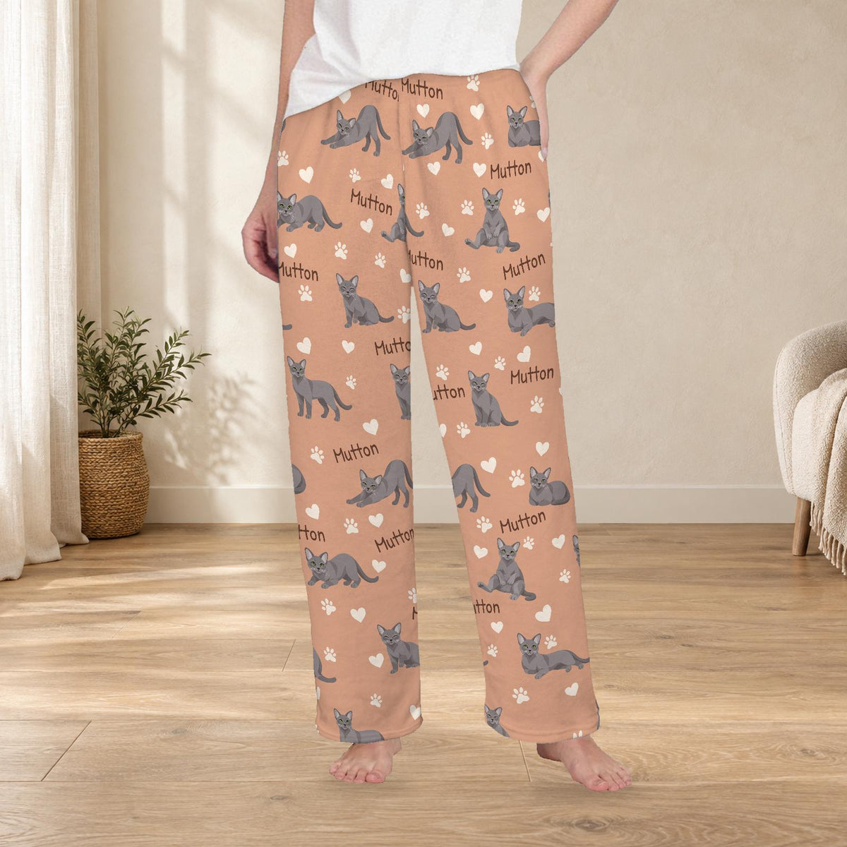 Korat personalized fleece pajama trousers on a model; women's fit, front view. Cozy neutral room background.