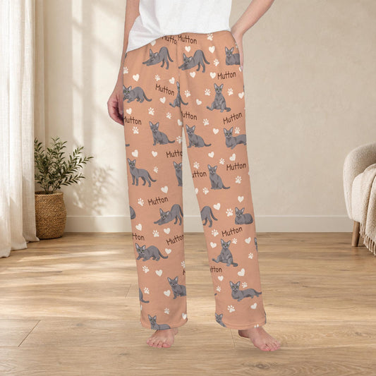 Korat personalized fleece pajama trousers on a model; women's fit, front view. Cozy neutral room background.