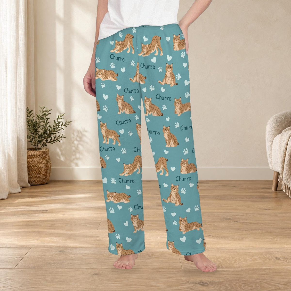 Pixie bob personalized fleece pajama trousers on a model; women's fit, front view. Cozy neutral room background.