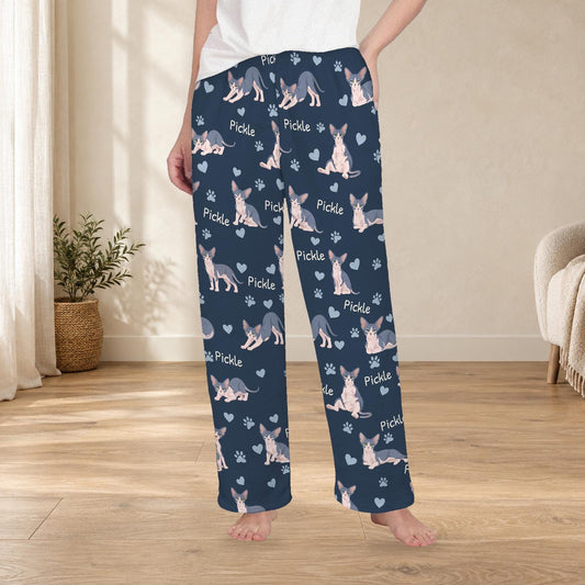 Sphynx personalized fleece pajama trousers on a model; women's fit, front view. Cozy neutral room background.