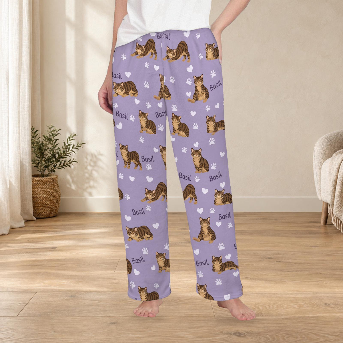 Manx personalized fleece pajama trousers on a model; women's fit, front view. Cozy neutral room background.